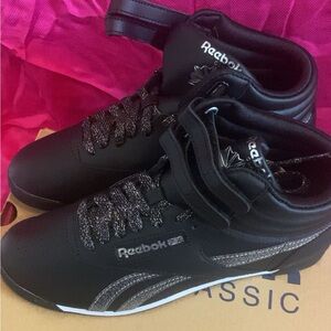 Never worn! Black Reebok Classic  high top! Women’s size 7. Original box